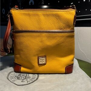 Dooney & Bourke dandelion pebble leather purse in almost new condition.